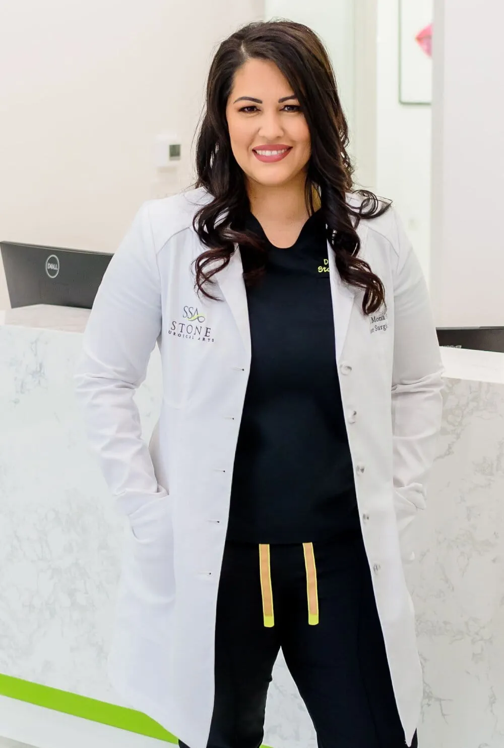 Dr. Mona Stone, DDS, in a white coat at the Westlake practice